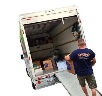 Movers loading and unloading items with equipment
