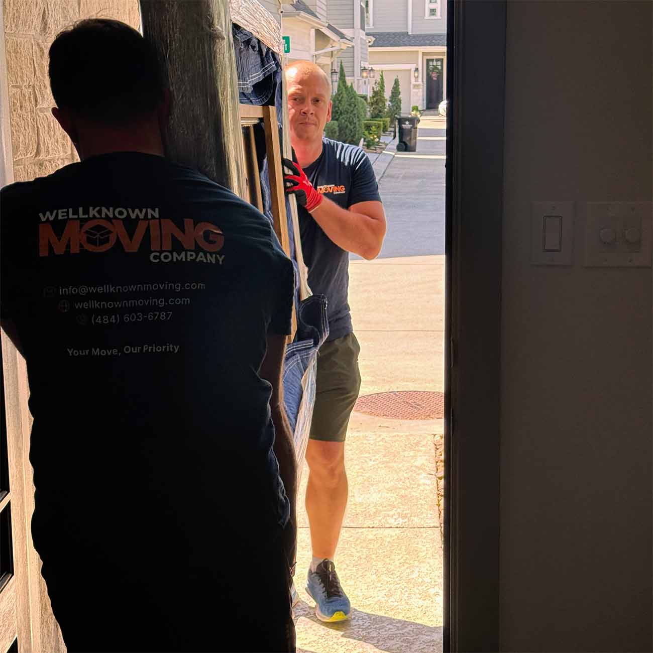Movers carrying furniture