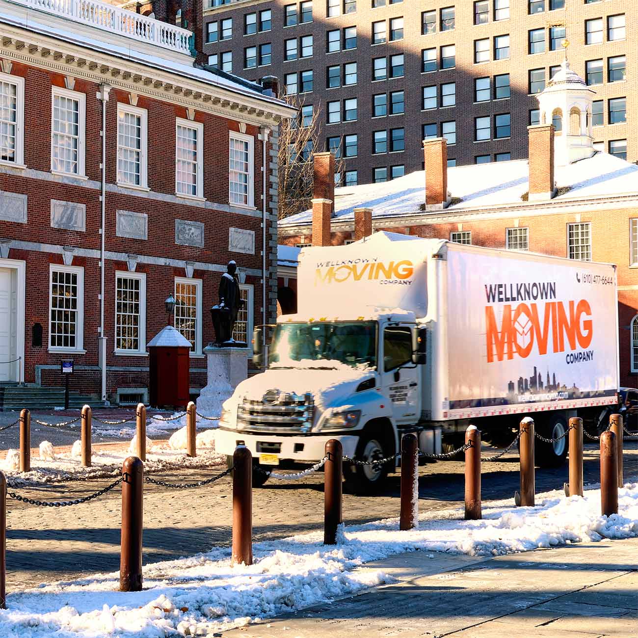 Moving truck by buildings